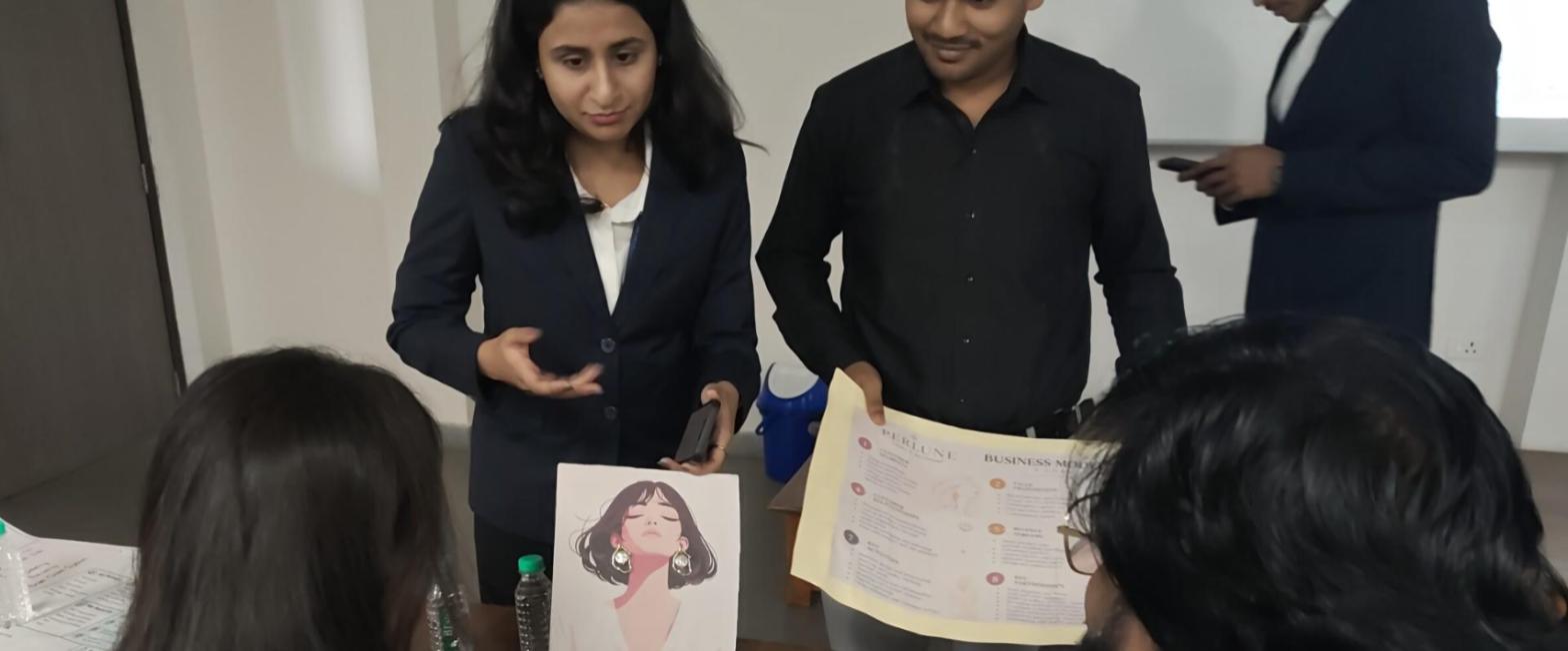 Student team presenting their pearl jewellery business model to the judging panel at SIES Pitch Arena